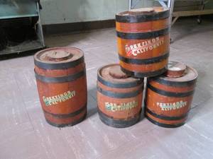 4 Small wood whiskey jugs...