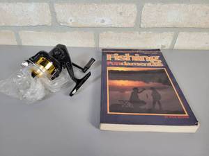 lot 665 image: NEW Optimax 101 Spinning Reel and The In-Fisherman Fishing Fundamentals Book