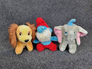 lot 199 image: Lot of (3) Vintage Cartoon Plush Characters - Lady from Disneys Lady & the Tramp, Papa Smurf, and Dumbo from Disneys Dumbo
