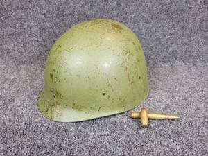 lot 299 image: Vietnam-Era M1 Steel Pot Helmet and Two Rounds of Ammunition