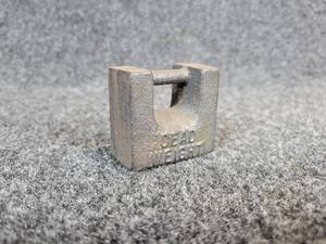 lot 311 image: Small Dead Weight Paperweight by Dotson Iron Casting