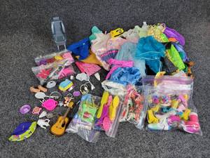 lot 383 image: Doll Accessories - Barbie Doll Clothes (vintage and modern), Accessories, 18 Doll Clothes
