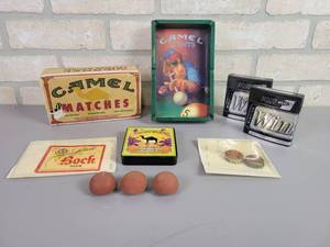 lot 30 image: Vintage Hauenstein (New Ulm, MN) Bottle Cap, Schells Bock Beer Labels, Camel Matches, Ash Tray, LUCKY Rubber Bottle Caps and More