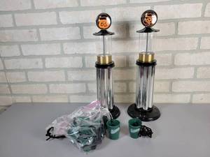 lot 425 image: (2) Phillips 66 Mini Visible Gas Pumps (17 Tall each) and (8) Dr. McGillicuddys necklace Shot Glasses