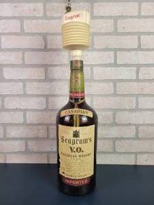 lot 2215 image: 1965 Seagrams Canadian Whiskey 1 Gallon Glass Bottle w Seagrams Dispenser
