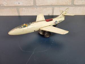 lot 2241 image: Vintage Skyrocket Tin Litho Friction Drive Navy Fighter Jet Toy