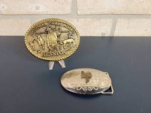 lot 2265 image: 1982 HESSTON Rodeo Belt Buckle and Unmarked Saddle Belt Buckle (Only marked Made in the USA)