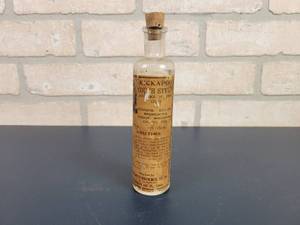 lot 2399 image: Antique KICKAPOO Cough Syrup Bottle - The Kickapoo Indian Med Co. Inc (18.75% Alcohol)