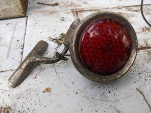 lot 232 image: Antique Red Glass Lens Taillight with Bracket