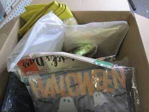 box of decorative pillow covers and...