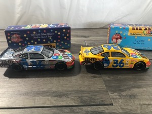 lot 23 image: 1999 NASCAR Racing Champions Ernie Irvan #36 M&Ms  Pedigree two car set 124 scale die cast stock cars