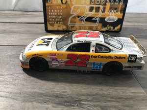 lot 28 image: 2000 NASCAR Racing Champions Under the lights Ward Burton #22  Cat Dealers 124 scale die cast stock car