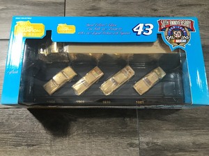 lot 43 image: 1998 NASCAR RICHARD PETTY GOLD  7 TIME CHAMP CAR & TRANSPORTER SET WITH AUTOGRAPH