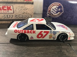 lot 59 image: 2000 NASCAR Action Racing 1990 Pontiac Jeff Gordon #67  Outback Steakhouse 124 scale die cast stock car