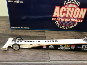 lot 109 image: 1995 NHRA Racing Action Platinum Series Tommy Johnson #10  Mopar Express Lube 124 scale die cast top fuel dragster
