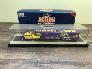 lot 114 image: 1995 Racing Action Platinum Series Jimmy Spencer #23  Camel Powered Smoking Joes Racing Dually Truck with triple axle trailer 164 scale die cast with protective case