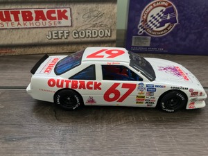 lot 163 image: 2000 NASCAR Action Racing Collectibles Jeff Gordon #67  Outback Steakhouse 1990 Pontiac 124 scale die cast stock car