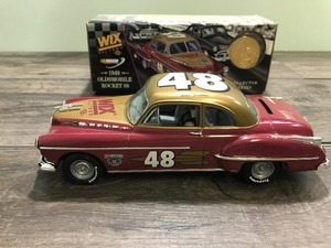 lot 177 image: 1998 NASCAR ERTL Collectibles 1949 Oldsmobile Rocket 88 - Bill France #48 Wix Filters 125 scale die cast coin bank