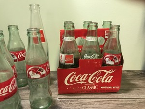 lot 223 image: Lot of Coca Cola bottles and cans