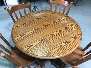 lot 7 image: Solid wood round dining table with 4 chairs