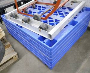 Stack of 7 blue plastic pallets