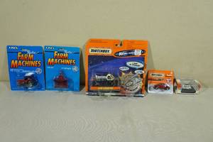 lot 181 image: Vintage Factory Sealed Matchbox and ERTL Farm Machines