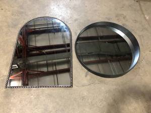 lot 18 image: Lot With Home Decorators Collection  Medium Arched Dark Bronze Antiqued Classic Accent Mirror (35 in. H x 24 in. W) and Medium Round Black Hooks Contemporary Mirror (27.5 in. H x 27.5 in. W)