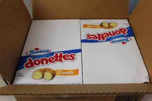 lot 320 image: Case of 2 Boxes of Hostess Crunch Mini Donuts