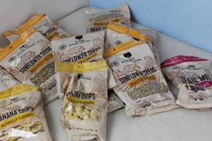 lot 339 image: 24 Bags of Natural Cravings Sunflower Seeds, Banana Chips, & Trail Mix (Random Selection) - Tastes Good