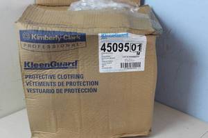 lot 544 image: Kimberly-Clark Kleenguard Chemical-Resistant Coveralls A60 45095 - Size M - Blue Packaging shows weathering, coveralls appear fine