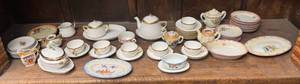 lot 154 image: Shelf Full Of Misc. Vintage Miniature Tea Sets Some Made In Japan