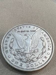 1887-O MORGAN SILVER DOLLAR AU (LOOKS BETTER IN HAND)