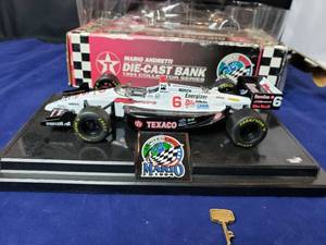 lot 24 image: Texaco 124 Mario Andretti Die-Cast Bank 1994 Collector Series