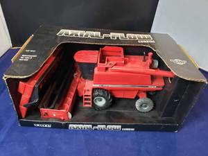 lot 90 image: 132 Ertl Case Axial Flow Combine
