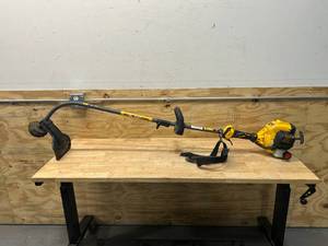 lot 57 image: DEWALT 27 cc 2-Stroke Gas Curved Shaft String Trimmer with Attachment Capability