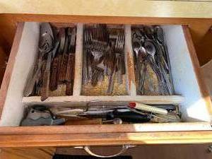 lot 146 image: Silverware Drawer Contents Steak Knives, Forks, Spoons and More