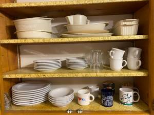 lot 149 image: Contents of Kitchen Cabinet Vintage BakewareMixing Bowls, Plates, and More