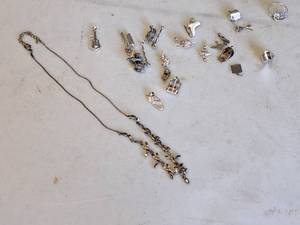 lot 1094 image: Womens Accessories - 18 Necklace (x1), Charms (x18), Ring (x1)