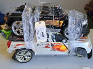 lot 1112 image: Lot of (2) 24 RC Cars (for parts or repair)