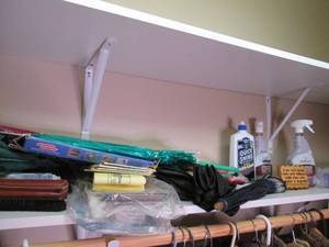 Assorted umbrellas, floor cleaning ...