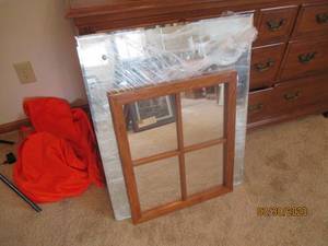 Large beveled mirror with 2 damaged...