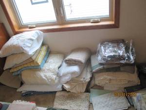 Large lot of bedding, pillows and a...