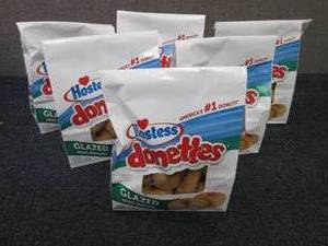lot 105 image: 6- 10.5 oz Bags Hostess Donettes...