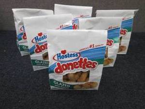 lot 106 image: 6- 10.5 oz Bags Hostess Donettes...
