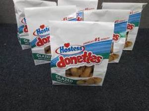 lot 107 image: 6- 10.5 oz Bags Hostess Donettes...
