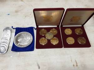 lot 24 image: Olympic, Casino Tokens & 5 Lb. Morgan Dollar Commemorative.