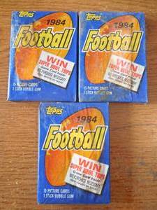 lot 50 image: (3) 1984 Topps Football Sealed Wax Packs 15 Cards