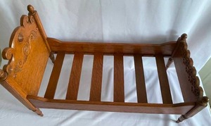 lot 109 image: Vintage Ornate Wooden Doll Bed
