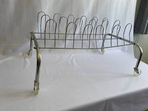 lot 138 image: Vintage Metal Shoe Rack on Plastic Wheels
