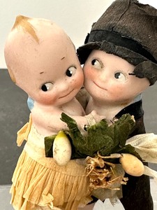 lot 63 image: Antique Kewpie Bride and Groom Doll